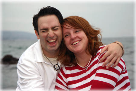 Couple frolicing on the beach